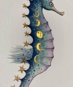 close up of hand embellished gold details on moonphase seahorse